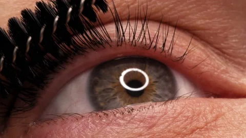 Applying black mascara to the eyelashes with a makeup brush. Stock Footage 161190424