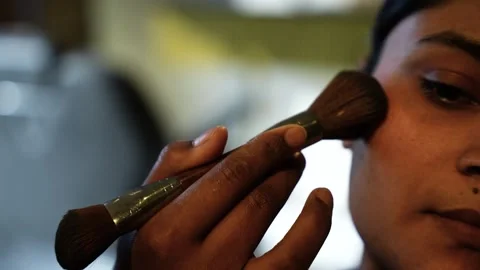 Applying blush with brush Stock Footage 325716641