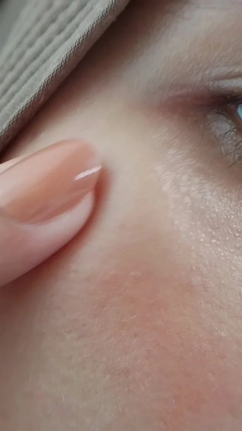 Applying blush face using fingers Stock Footage 332227501