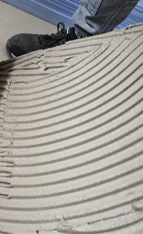 Applying Cement Adhesive to XPS Foam Board Close Up Vertical 9 16 Stock Footage 340643623