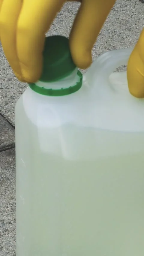Applying chlorine solution on pavement surface for cleaning Stock Footage 311000062