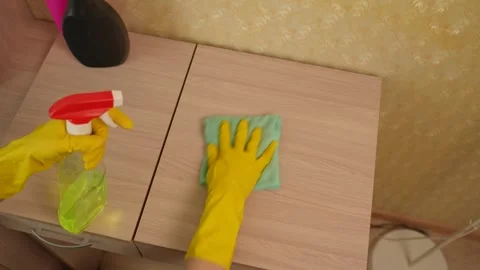 Applying cleaning solution to the surface of the furniture. Wet cleaning using Video stock 309926935