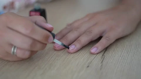 Applying Clear Nail Polish on Fingernails Close Up Manicure Stock Footage 341575319