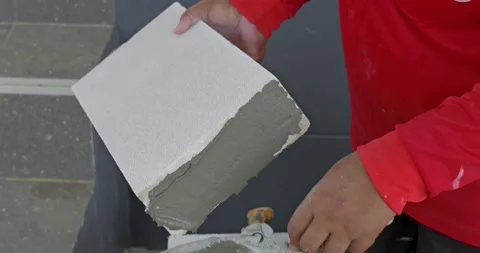 Applying concrete mixture construction site tutorial urban environment close-up Video stock 329220476