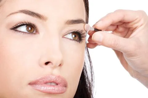 Applying cosmetic with applicator Stock Photos