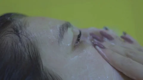 Applying cream on face Stock Footage 83633048