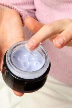 Applying cream Foto stock