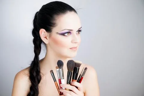 Applying creative makeup Stock Photos