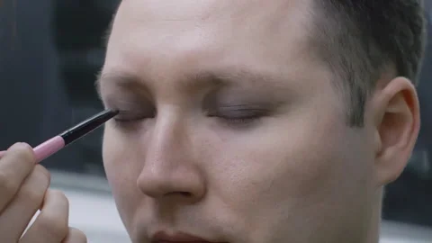 Applying Dark Eyeshadow Makeup to a Man Video stock 330921419