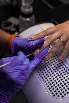 Applying decorative elements to french manicure with brush Foto stock