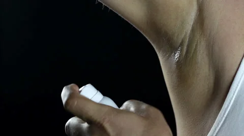 Applying a deodorant Stock-Footage 38006983