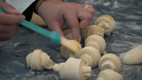 Applying Egg Wash to Croissants Stock Footage 317472652