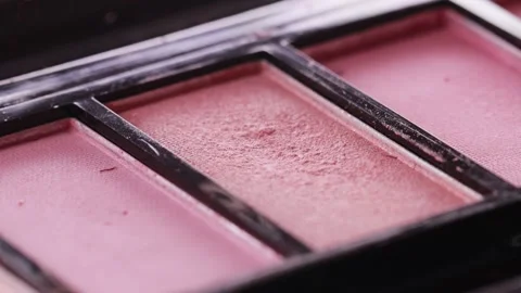 Applying eye shadow to a makeup brush. Modern cosmetics for the face, macro Stock-Footage 254660740