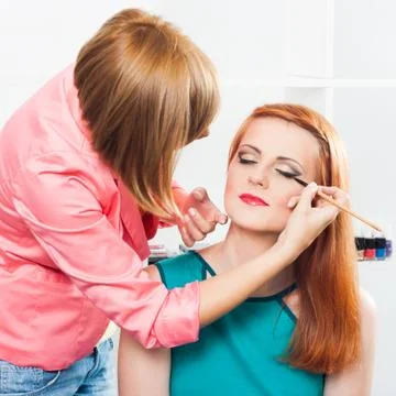 Applying eyeliner Stock Photos