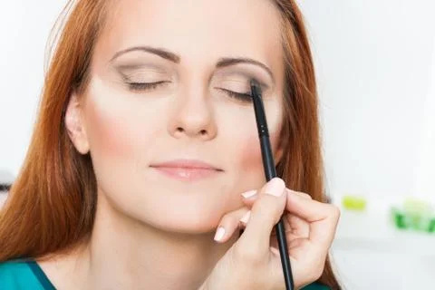 Applying eyeshadow powder Stock Photos