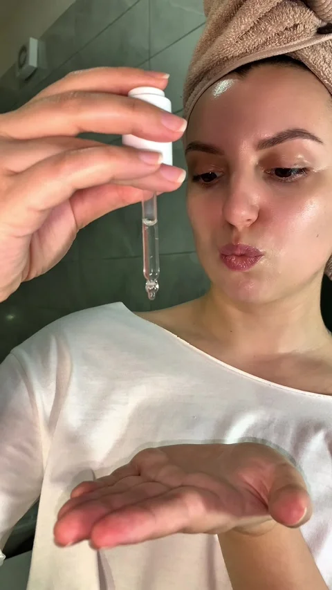 Applying Face Serum from Dropper – Skincare Routine Stock Footage 313679746