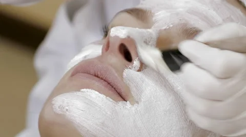 Applying Facial Mask Stock Footage 60768618