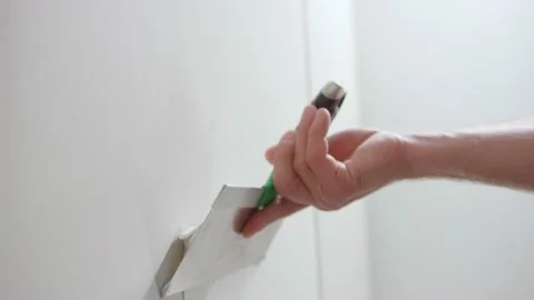 Applying finishing putty on a white wall Video stock 163294490