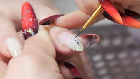 Applying a floral pattern to the nail. Stock Footage 211477512