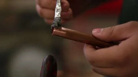 Applying flux copper pipe Stock-Footage 10590295