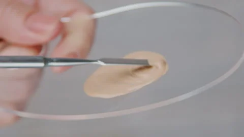 Applying Foundation A Comprehensive Professional Makeup Technique for Flawless Stock Footage 302834481