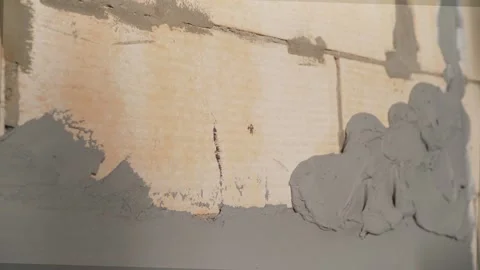 Applying fresh plaster mortar on aerated concrete block wall during construction Stock Footage 345537449