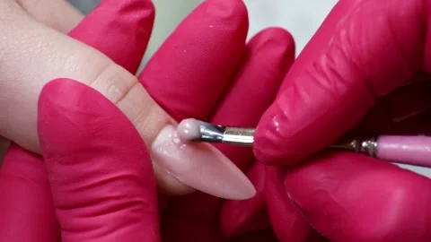 Applying Gel to Artificial Nails During a Manicure Stock Footage 130476239