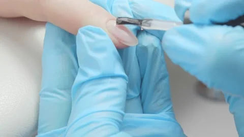 Applying gel polish on nails Stock Footage 195737555