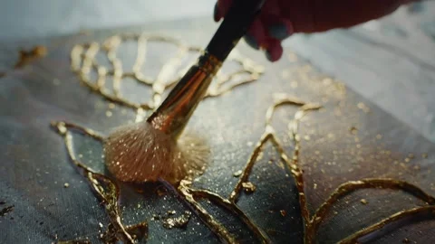 Applying Gold Leaf to Resin Artwork Stock Footage 279919719