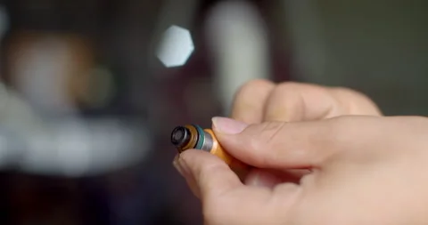 Applying grease to the fuel injector O-ring to ensure smooth insertion. Stock Footage 314767654