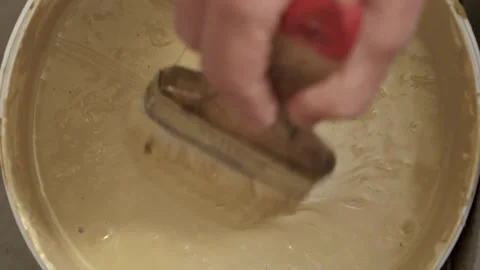 Applying insulating glue with a brush Video stock 130580637