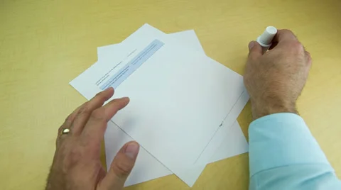 Applying liquid paper to cover up print out Stock Footage 32243376