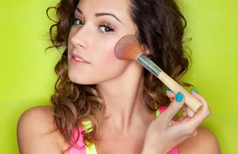 Applying make up concept, woman with cosmetic brush Stock Photos