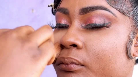 Applying make up powder on face of a person.	 Stock Footage 217877129