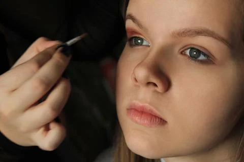 Applying makeup on a model with perfect skin Foto stock