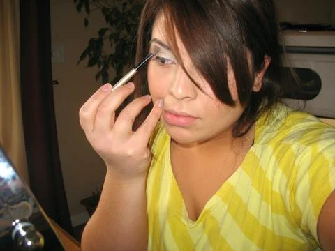 Applying makeup Stock Photos
