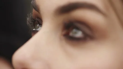 Applying mascara on beutiful young woman's eye- close up Stock-Footage 85671033