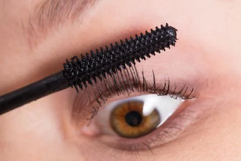 Applying mascara closeup Stock Photos