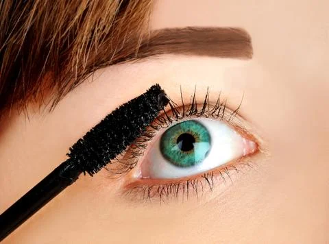Applying mascara Photos