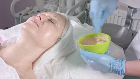 Applying a mask in the spa Stock Footage 76476098