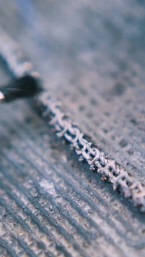 Applying material onto heating chain on fireproof surface Stock Footage 317091212