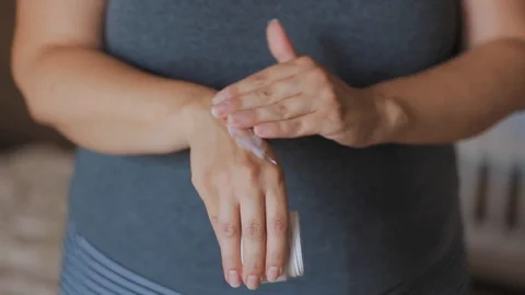 Applying moisturizing cream Stock Footage 111972272