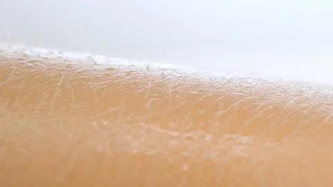 Applying moisturizing serum to skin of the hand and smearing liquid on the hand Stock Footage 165285308
