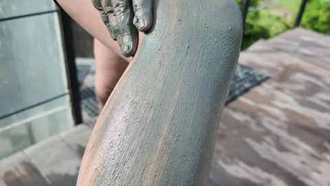 Applying mud on the legs Stock Footage 257755491