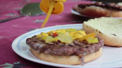 Applying Mustard To A Burger Stock Footage 52671204