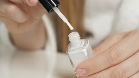 Applying nail polish to the nail. Close-up of a nail brush. Manicure. Stock Footage 267206683