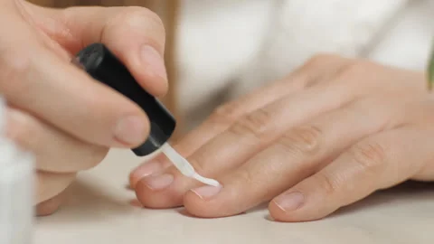 Applying nail polish to the nail. Close-up of a nail brush. Manicure Stock Footage 267208153