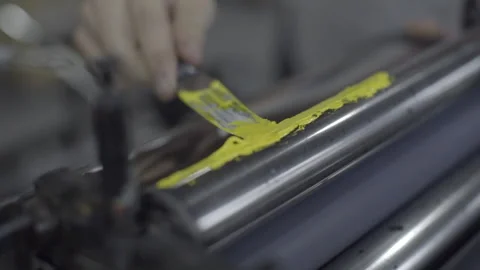 Applying paint mix to the letterpress machine Stock Footage 160519173