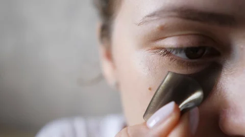 Applying a patch under the eye of a young woman close-up. Beauty and health Stock Footage 119905687