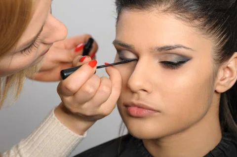 Applying perfect makeup Stock Photos